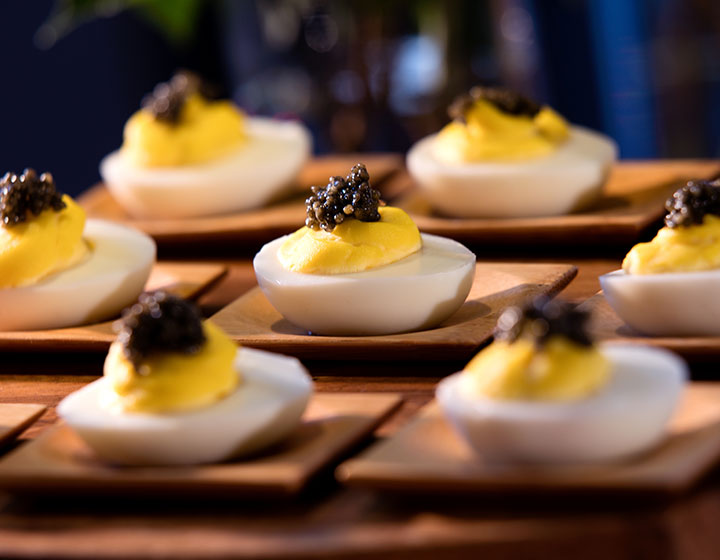 Deviled egg hors d'oeuvre neatly placed in rows